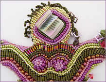 detail of head, Doll 2, one in a series of beaded dolls by Robin Atkins, bead artist